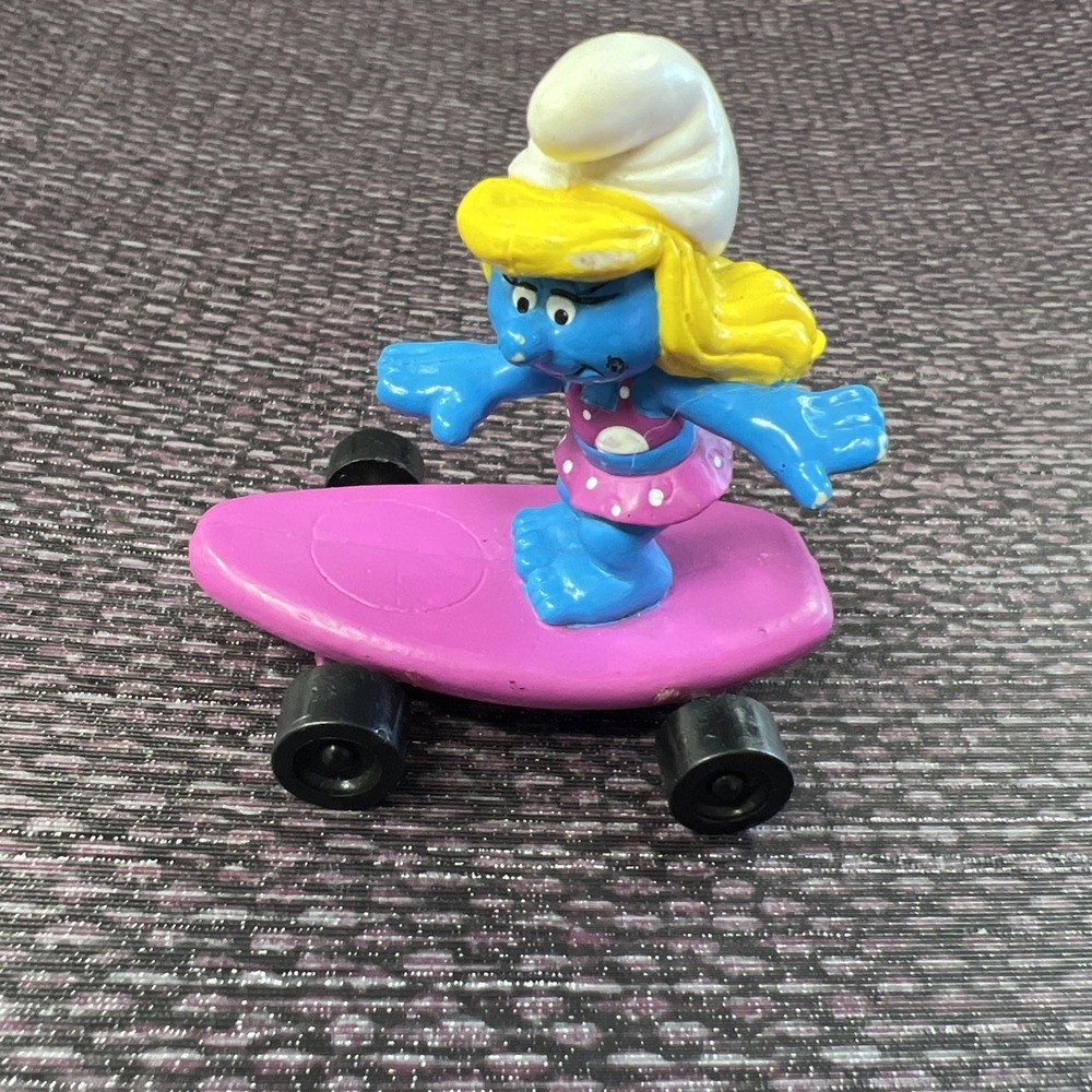 Hardees Kids Meal Toy 1990 Smurfs - Smurfette on Purple Skateboard